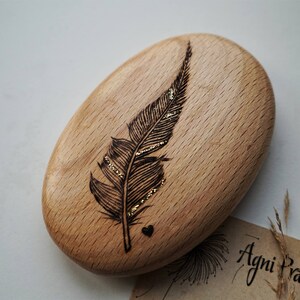 Memorial glitter feather keepsake, wooden pebble with freehand original pyrography