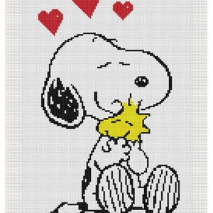 May include: Cross-stitch design featuring Snoopy from Peanuts, holding a yellow flower. Snoopy is white with black accents, sitting with his eyes closed. Three red hearts float above his head on a white background.