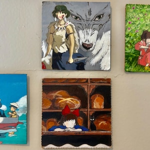 May include: Five square paintings depicting scenes from animated films. One shows a woman with a wolf, another shows two children in a field, a third shows a boat on the water, a fourth shows a girl in a bakery, and the last shows two children.