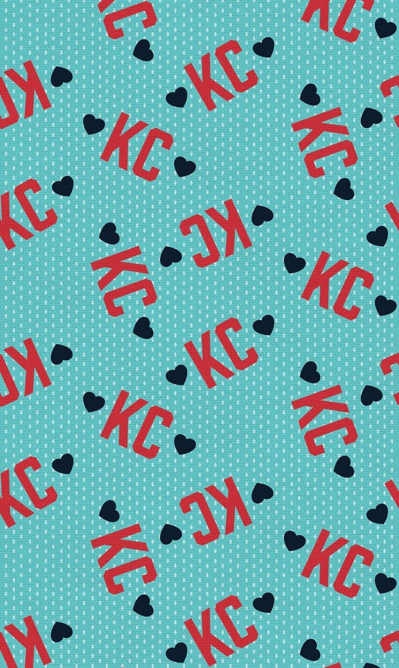 May include: A teal background with a repeating pattern of red "KC" letters and black heart shapes. The letters are in a bold, sans-serif font, and the hearts are solid. The background has a subtle dotted texture.
