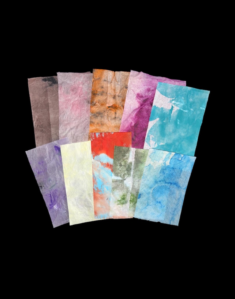May include: A collection of ten rectangular sheets of textured paper, each featuring unique watercolor-style patterns in various colors including brown, pink, orange, purple, yellow, red, green, and multiple shades of blue, arranged in a fan.