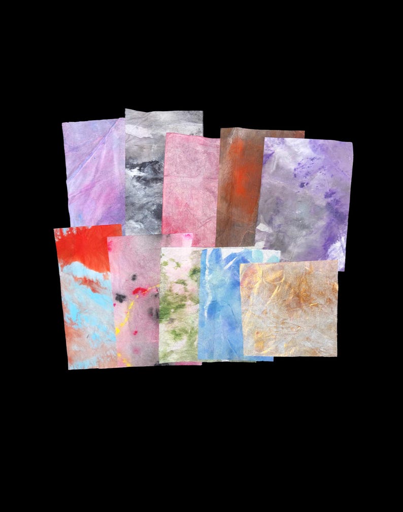 May include: A collection of rectangular paper sheets featuring various abstract patterns and colors, including shades of purple, pink, blue, green, orange, and brown. The papers have a textured, semi-translucent appearance with visible fibers.