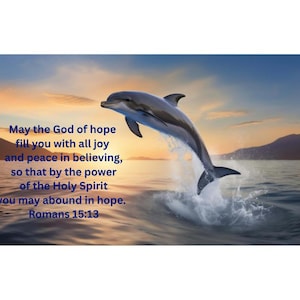 May include: A dolphin leaps from the ocean, set against a sunset sky. The image includes text from Romans 15:13: "May the God of hope fill you with all joy and peace in believing..."
