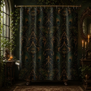 May include: A shower curtain featuring a dark, intricate pattern of peacock feathers, stylized eyes, and moth silhouettes in shades of deep teal, forest green, and gold. The fabric hangs from a gold-toned rod with matching circular rings.