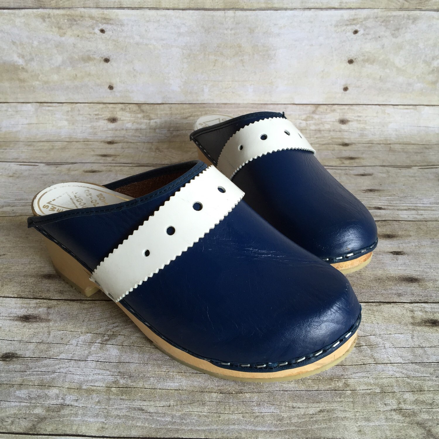 blue leather clogs