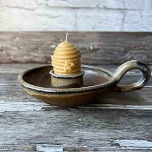 May include: A rustic wooden sign with the text "Welcome to our home" in a handwritten style. The sign features a distressed finish and a simple, inviting design, perfect for entryway decor.