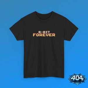 May include: A black short-sleeve t-shirt featuring the text 8-BIT FOREVER printed in a pixelated font with a horizontal gradient of yellow, orange, and red stripes across the letters, centered on the chest area of the garment.