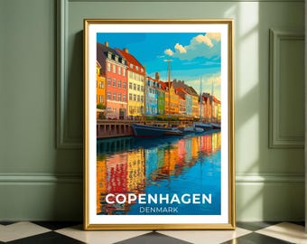 May include: Framed art print of Copenhagen, Denmark. The image features colorful buildings along a canal, with boats and reflections in the water. The text "COPENHAGEN DENMARK" is at the bottom of the print.