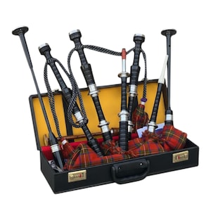 May include: A set of bagpipes in a black case with a yellow interior. The bagpipes are black with silver accents and red and green plaid fabric. The case has a handle and a combination lock.