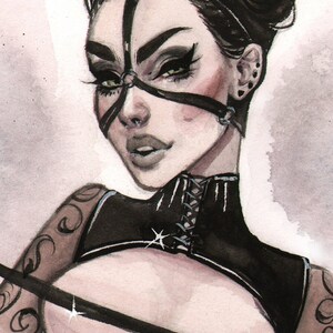 May include: Watercolour illustration of a person in a black cat-ear headpiece and matching harness. The artwork features detailed facial features, including dark eye makeup and a nose ring. The person is wearing a black top with a lace-up front.