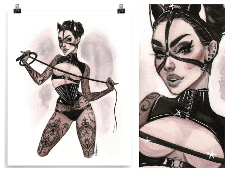 May include: Watercolour illustration of a woman in black lingerie, a corset, and a cat-ear headpiece, holding a whip. The artwork features intricate tattoo designs on the arms and legs, with a detailed face and dark makeup. The background is a soft, watercolour wash.