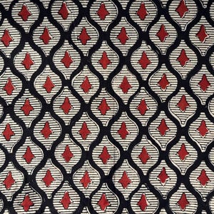 May include: A textile featuring a repeating pattern of red diamond shapes set against a black and white design. The diamonds are enclosed within a white, striped, teardrop-shaped outline, creating a striking visual effect.