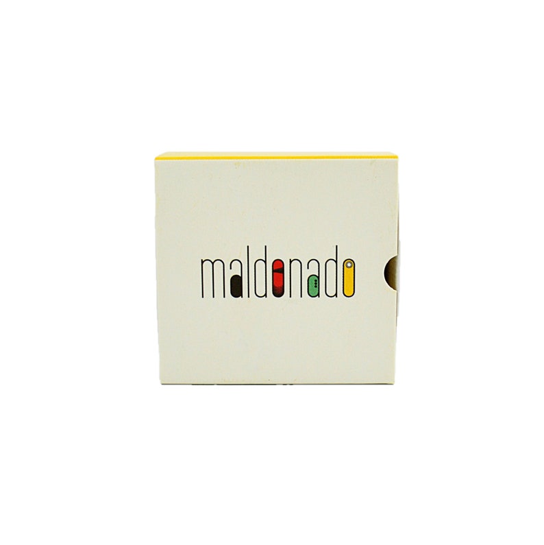 May include: A white box with a yellow top and the word "maldonado" in black letters with colored accents.