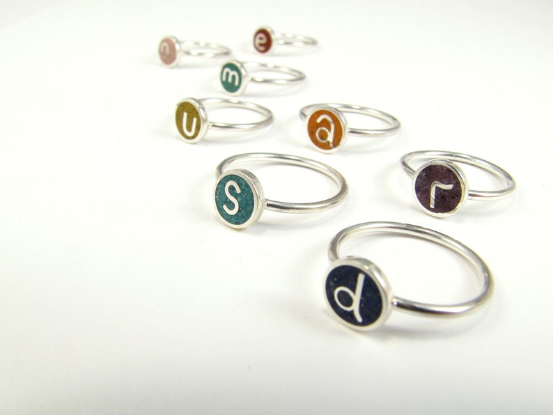 playful rings with initial color on sterling silver by maldonado jewelry