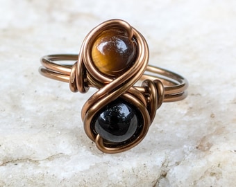 Ring met zwarte onyx tijgeroog / Infinity-ring / Kristallen sieraden voor sterrenbeeld Leeuw Steenbok