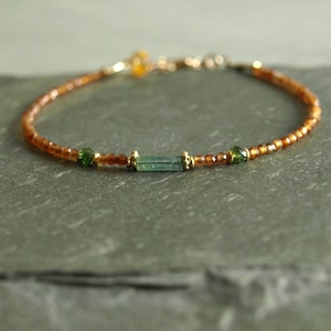 Tiny Hessonite Garnet and Tourmaline bracelet, whiskey golden garnet, blue and green tourmaline, gold beads, slender minimal women's jewelry