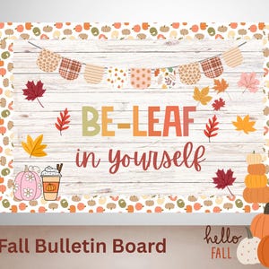 May include: Fall-themed bulletin board with a wooden background, featuring the text "BE-LEAF in yourself." The design includes fall leaves, pumpkins, and a banner. The words "hello FALL" are also visible.