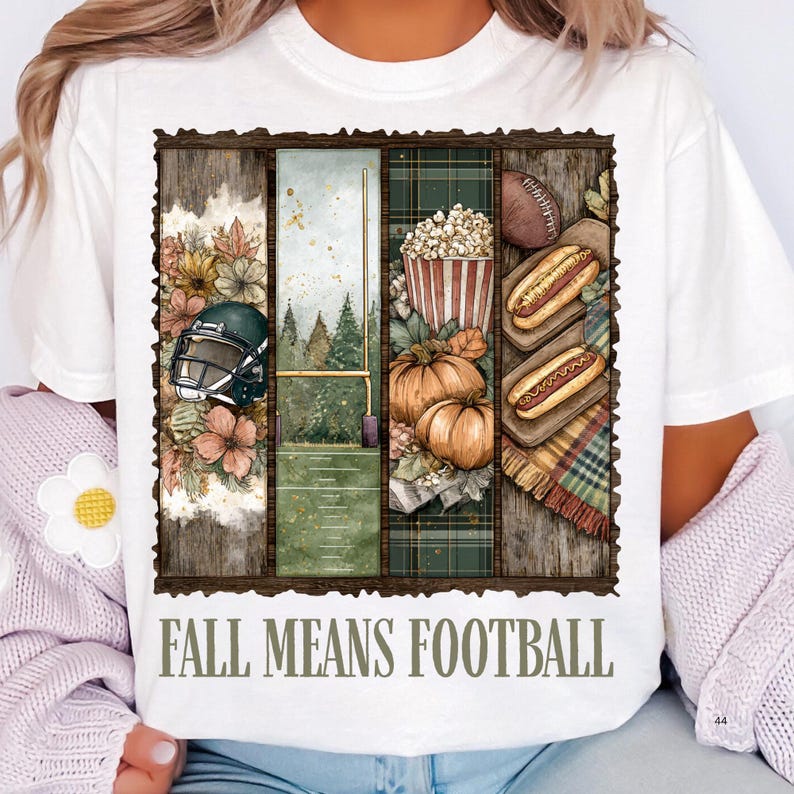 May include: White t-shirt with a rectangular graphic featuring football-themed illustrations. The graphic includes a football helmet, a football, pumpkins, popcorn, and hot dogs. The text "FALL MEANS FOOTBALL" is printed below the graphic.