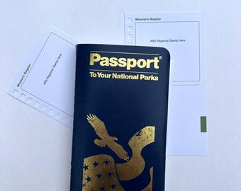 May include: A navy blue "Passport To Your National Parks" booklet with gold lettering and a gold eagle graphic. Two white cards with "Western Region" text and space for stamps are also visible.