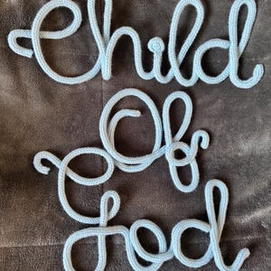 May include: A set of three ceramic mugs with a speckled, matte finish. The mugs are in shades of cream, light gray, and dark gray. Each mug has a simple, minimalist design and a rounded handle. Perfect for coffee or tea.