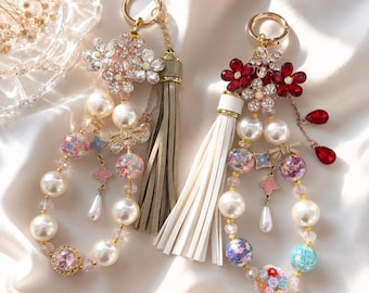 Charm de lujo con diseño floral para bolso, charm de perlas y cristales para monedero, llavero de flores brillantes, charm elegante con borla de cuentas.