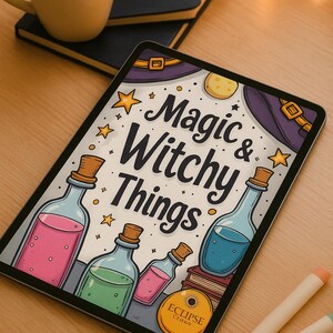 May include: A tablet displays a colorful illustration with the text "Magic & Witchy Things." The image features potion bottles with pink, green, and blue liquids, along with stars, a witch hat, and a moon. A mug of coffee and notebooks are in the background.