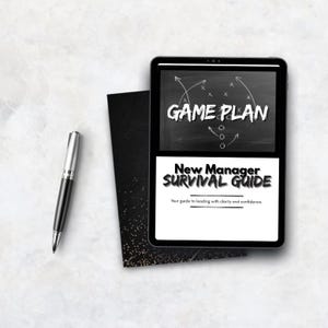 May include: A black tablet shows the text "GAME PLAN" and "New Manager Survival Guide". A black pen and a black card with gold specks are next to the tablet. The text "Your guide to leading with clarity and confidence" is also visible.