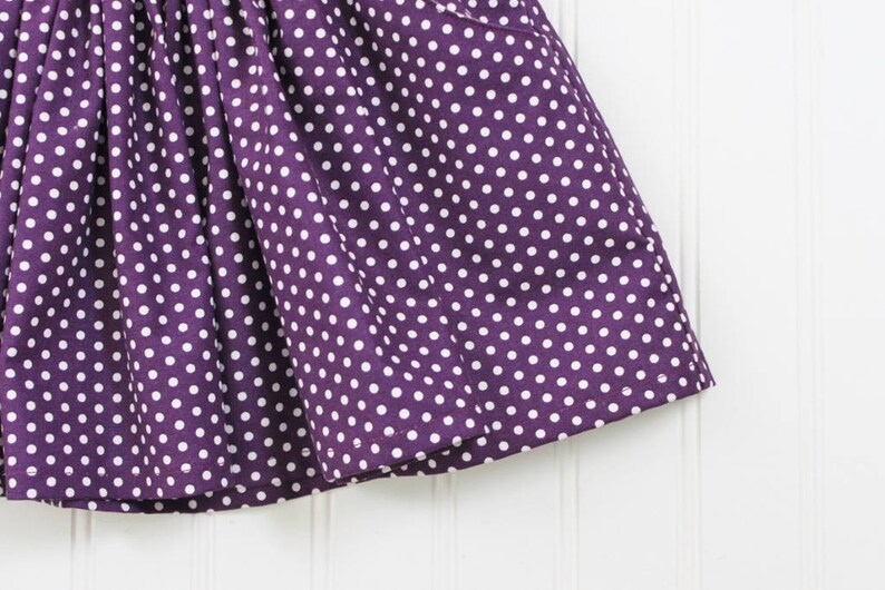purple school pinafore
