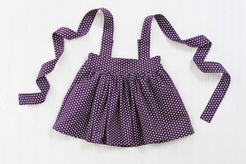 purple school pinafore