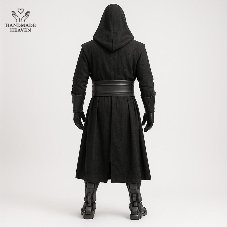 May include: A black hooded cloak with a wide belt, gloves, and boots. The cloak has a long, flowing design and is made of a dark fabric. The boots have a detailed, armored appearance. The Handmade Heaven logo is in the upper left corner.