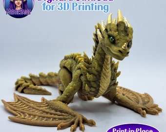 May include: A 3D printed, print-in-place, green and gold dragon with wings. The dragon is posed in a crawling position with its head raised. The text "Print-in-Place No Supports" is visible in the image.