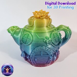 May include: A rainbow-colored teapot with a flower on top and a small door on the bottom. The teapot is decorated with vines and windows. Digital Download for 3D Printing.