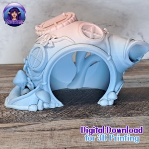 May include: A 3D printed model of a whimsical fairy house with a blue and pink gradient. The house has a rounded shape with a small door and windows. The house is surrounded by mushrooms.