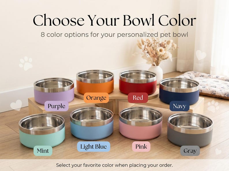 May include: Image shows eight stainless steel pet bowls with colored exteriors: purple, orange, red, navy, mint, light blue, pink, and gray. Text reads "Choose Your Bowl Color" and "8 color options for your personalized pet bowl."
