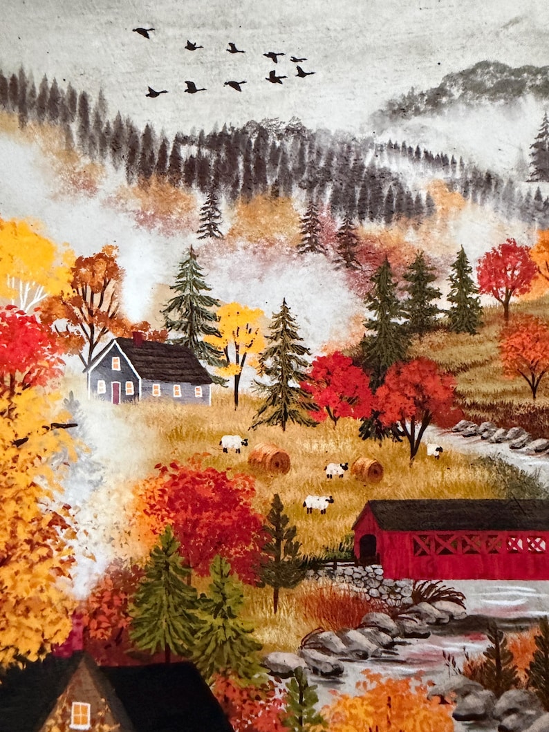 May include: A painting of an autumn landscape featuring a grey house with smoke, a red covered bridge over a stream, and sheep grazing in a field. The scene includes vibrant red and yellow trees, evergreen pines, and a flock of birds in the sky.