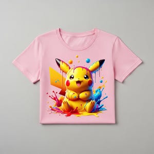 Peut inclure: T-shirt rose clair avec un motif vif de Pikachu, un personnage jaune avec des oreilles &agrave; pointes noires et des joues rouges. Le motif comprend des &eacute;claboussures de peinture color&eacute;es en bleu, rouge et jaune. Le t-shirt a un col rond et des manches courtes.
