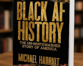 May include: A hardback book titled Black AF History: The Un-Whitewashed Story of America by Michael Harriot. The black cover features large gold textured lettering and a historical painting with red X marks over figures and red text labels.