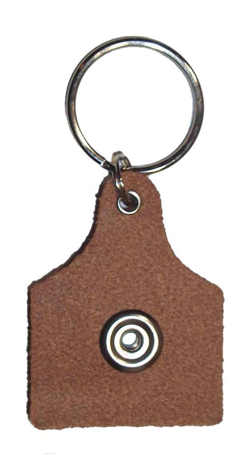 Snap keyring with a removeable personalized volleyball button on a leather key fob