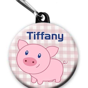 Cute pig button personalized with name on your choice of items: Zipper pull, pin, or magnet.