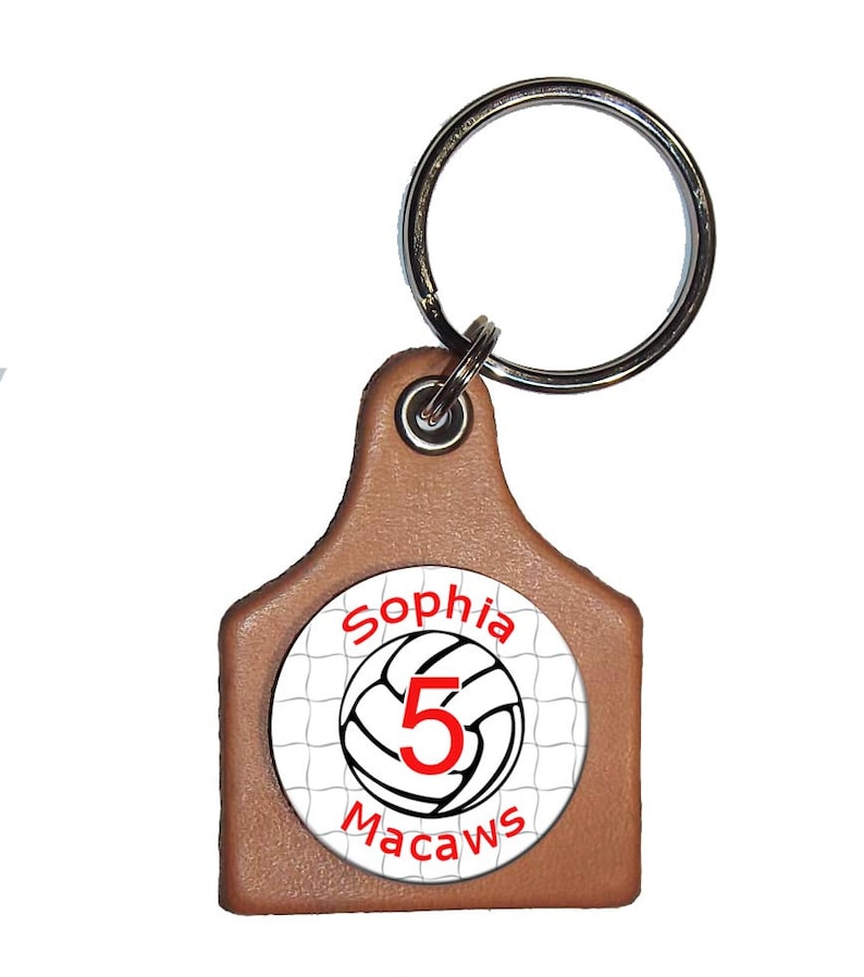Snap keyring with a removeable personalized volleyball button on a leather key fob