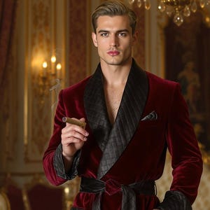May include: A deep red velvet dressing gown with black satin detailing. The robe has a quilted lapel, a matching belt, and pocket details. This luxurious garment is suitable for lounging.
