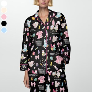 May include: Black pajama set with a repeating pattern of Easter bunnies wearing masks, medical supplies, and text. The pajamas have pink trim and the text "#Nurselife" is visible.