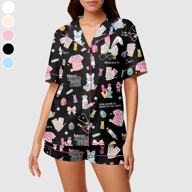 May include: Black pajama set with a print of bunnies, medical equipment, and text. The short-sleeved top and shorts have pink trim. The text includes "Bunny's Nurse" and "#Nurselife".