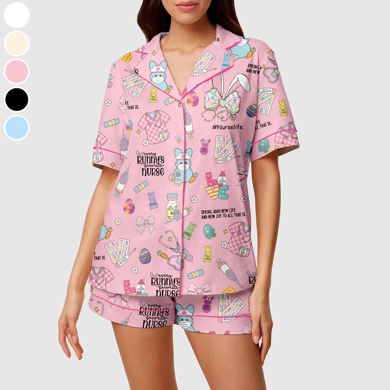 May include: Pink pajama set with a short-sleeved button-up top and matching shorts. The set features a repeating pattern of bunnies, medical supplies, and the text "Every Bunny's Favorite Nurse". The trim is pink.