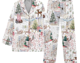 May include: White pajama set with a festive holiday print featuring Christmas trees, reindeer, and figures. The long-sleeved top and pants have red trim. The set is made of a soft material.
