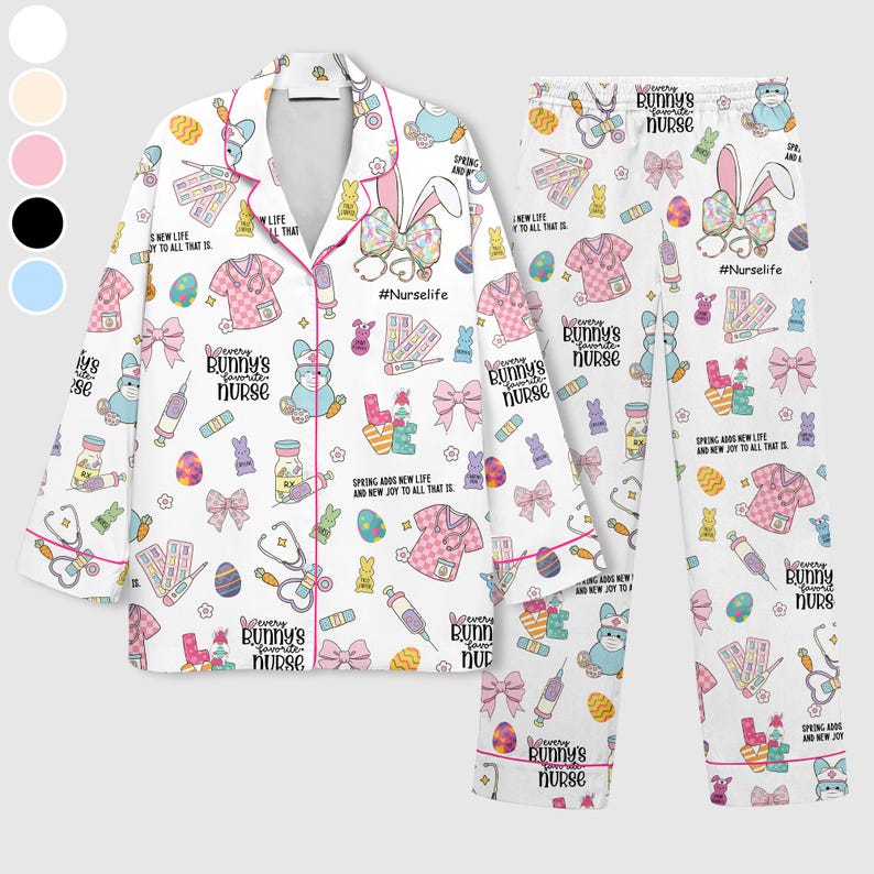May include: White pajama set with a repeating pattern of Easter-themed graphics, including bunnies, bows, and medical supplies. The set features a collared button-down shirt and matching pants, trimmed with pink piping. Text includes "#NurseLife" and "Every Bunny's Favorite Nurse."