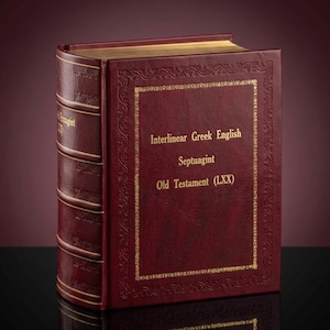 May include: A maroon leather-bound book with gold lettering and trim. The book's cover reads "Interlinear Greek English Septuagint Old Testament (LXX)". The spine has gold accents. The book is open, revealing gold-edged pages.