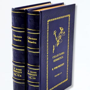 May include: Two navy blue hardback books with gold lettering and detailing. The books are titled "Collectanea Hermetica" by W. Wynn Westcott. Volume I-V and VI-X are visible. The cover features a gold illustration and decorative border.