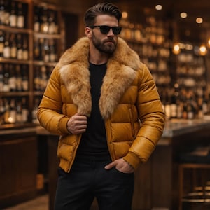 May include: Mustard yellow puffer jacket with a tan fur collar. The jacket has a quilted design and is worn with a black shirt and trousers. The background features a bar with bottles of wine.