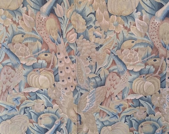 May include: Textile with a repeating pattern of peacocks, pumpkins, and floral elements in muted tones of blue, beige, and peach. The design features detailed illustrations of the birds and foliage, creating a vintage aesthetic.